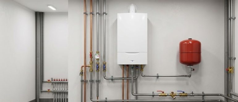 Настенный газовый котёл отопления в чистой котельной с обвязкой